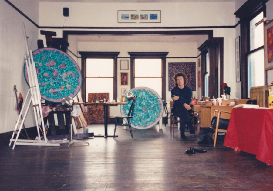 Me sitting in studio 1990 with paintings in progress.