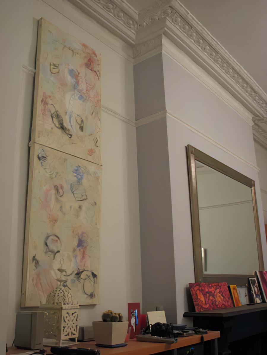 A mixed media painting on the wall of Naomi's apartment in London, England.